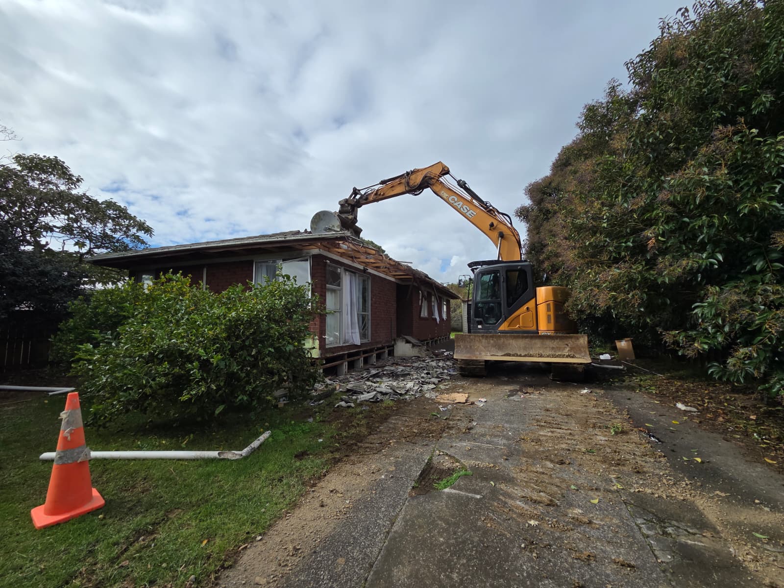 Coming down — The old home is taken down section by section